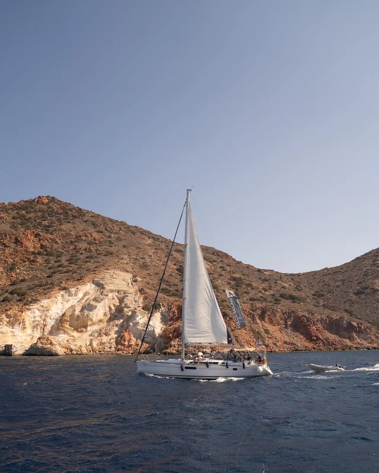 boat sailing around milos island