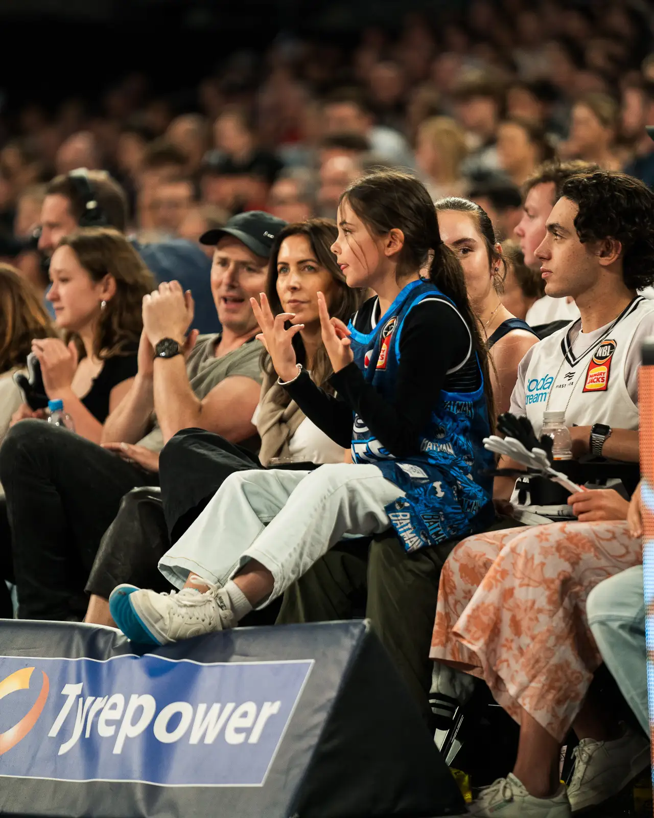 a young melbourne united fan celebrating at john cain arena