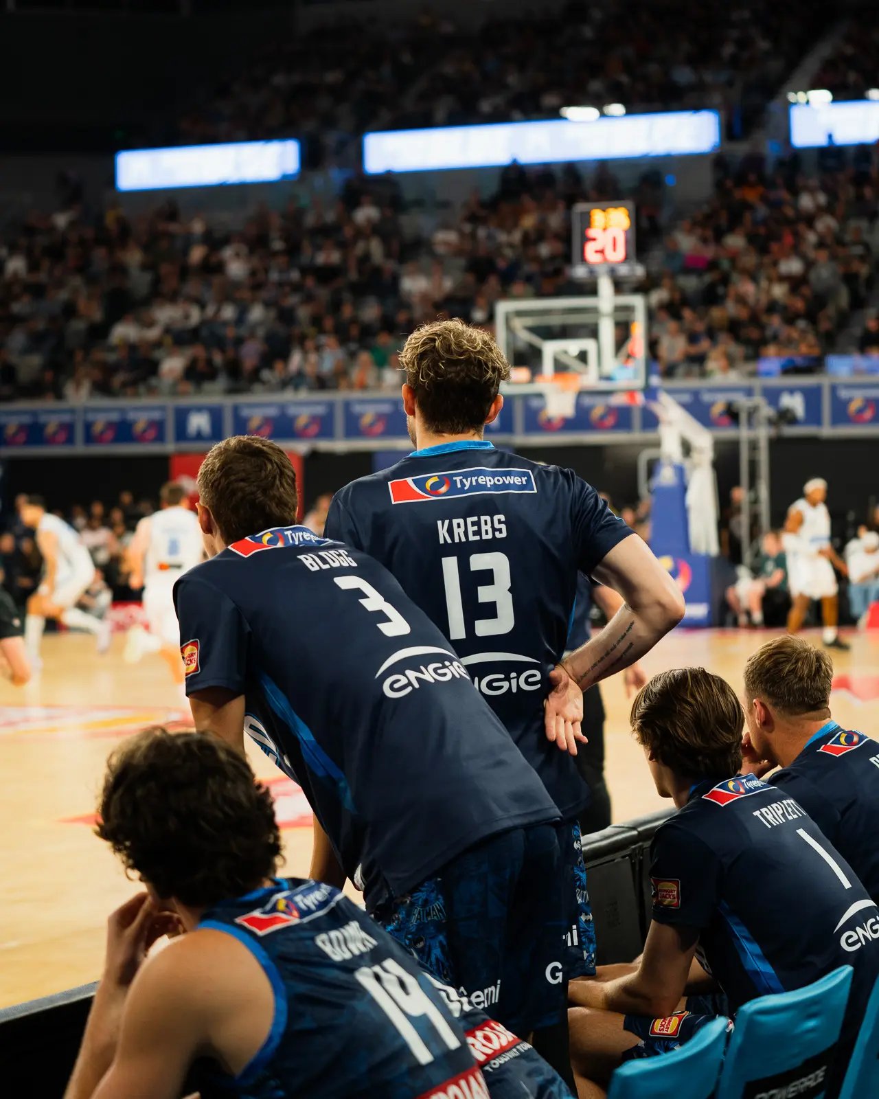 melbourne united players watching the nbl game vs brisbane bullets