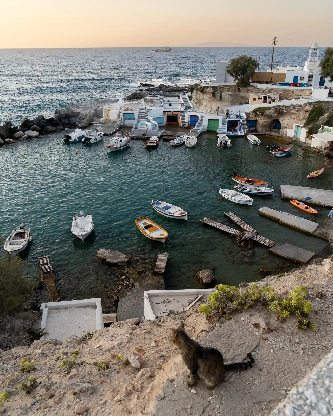 Mandrakia Fishing Village at sunset, in milos, greece