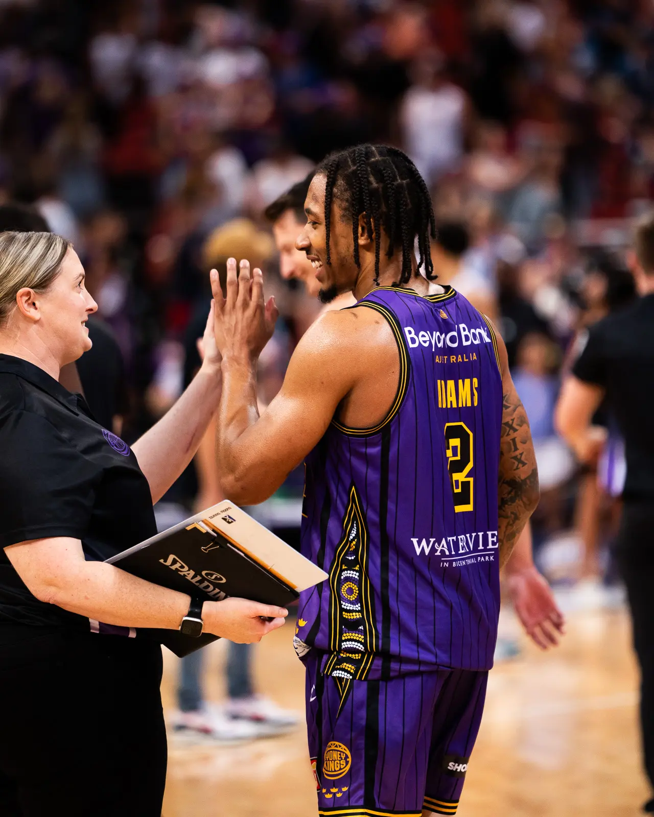 sydney kings nbl basketball - fleur mcintyre and jalen adams celebrating