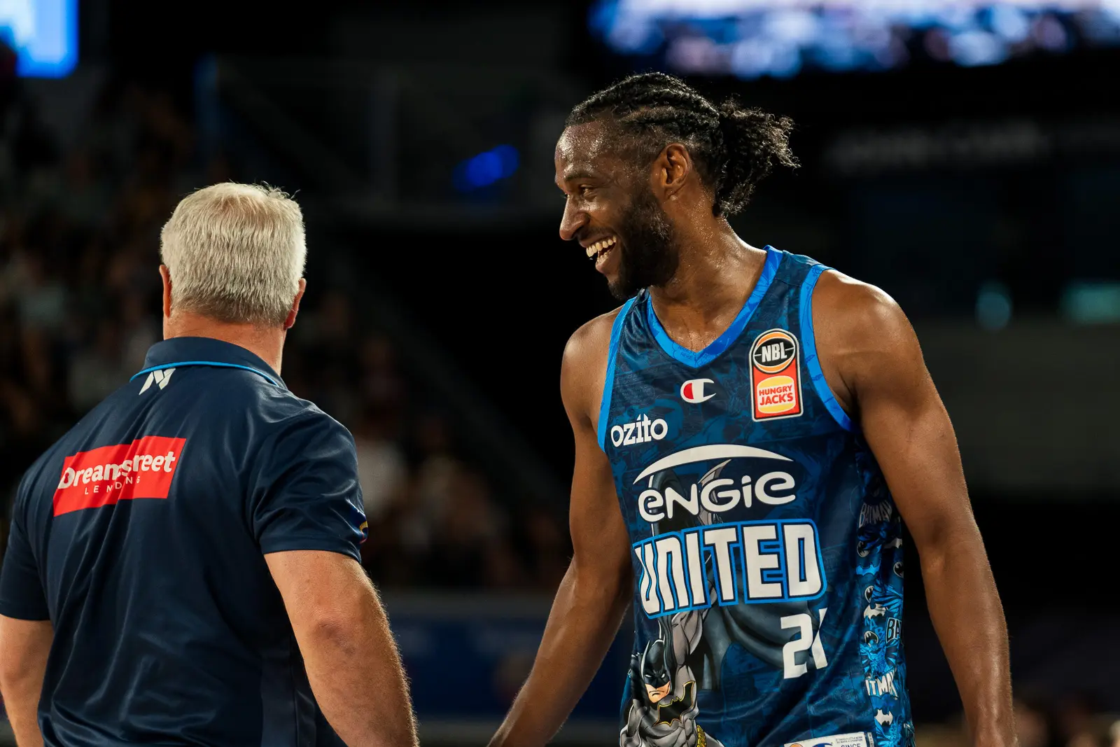 coach dean vickerman and smiling ian clark during melbourne united nbl game