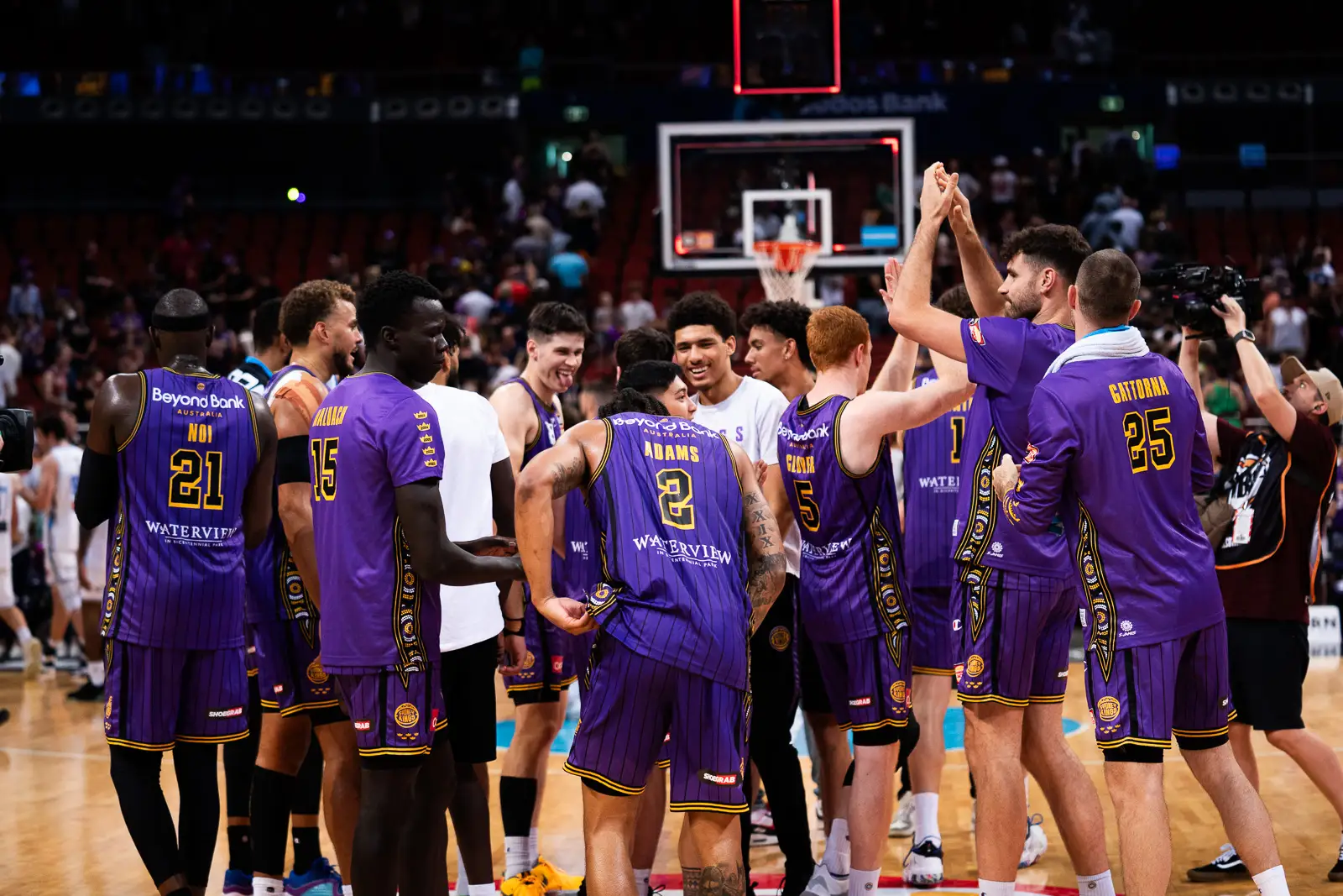 sports photograpy of the sydney kings celebrating their win at qudos bank arena vs brisbane bullets