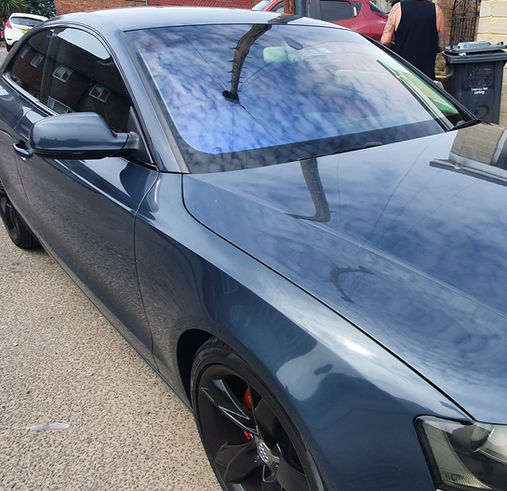 Side of black car with chameleon tinted windows 3_edited.jpg