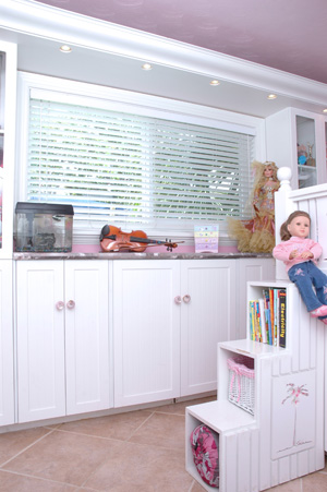 Custom Cabinetry with a pink stone countertop touch
