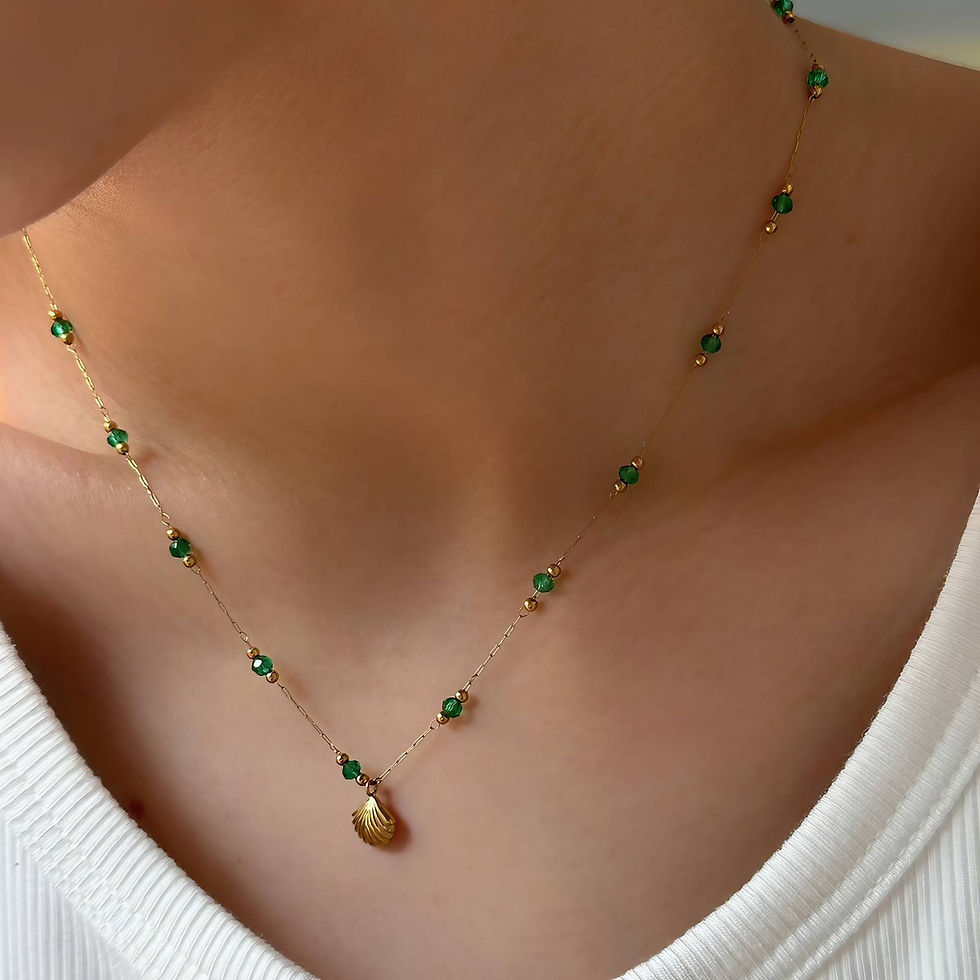 Woman wearing gold necklace with green stones. Necklace, 18K Gold Plated Steel Donna's Dazzling.