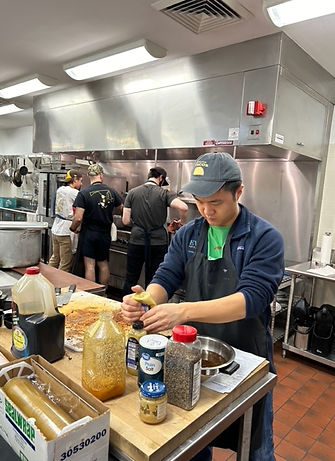 Volunteer organizing food pantry in Norfolk