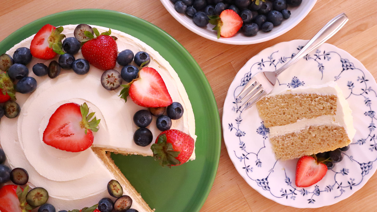 Vanilla Layer Cake decorated with fresh berries.