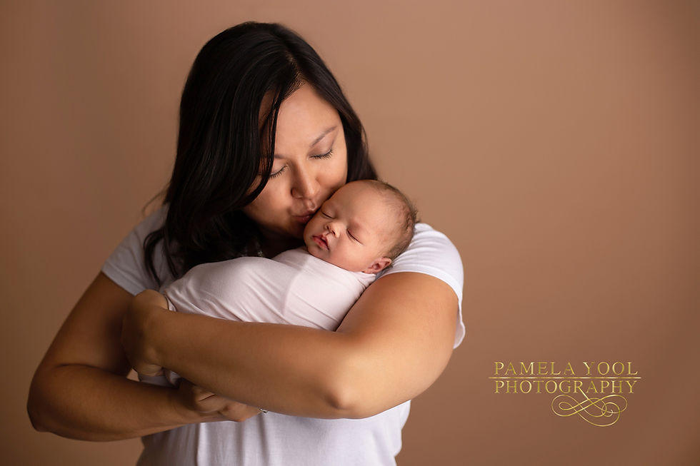 mom kissing newborn baby photography 