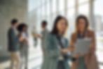 happy-businesswomen-using-laptop-in-a-hallway-of-a-2026-03-25-04-29-49-utc.jpg