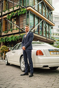 ROLLS-ROYCE GHOST CHAUFFEUR STANDING OUTSIDE