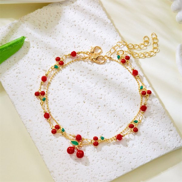Thumbnail: Elegant red crystal heart bracelet with colorful zircon stones on a gold metal link chain.