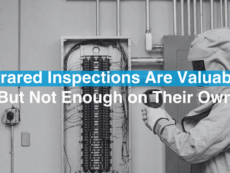 Electrical worker conducting an infrared electrical inspection of switchgear with a thermal imaging camera to identify potential equipment failures and improve electrical safety.