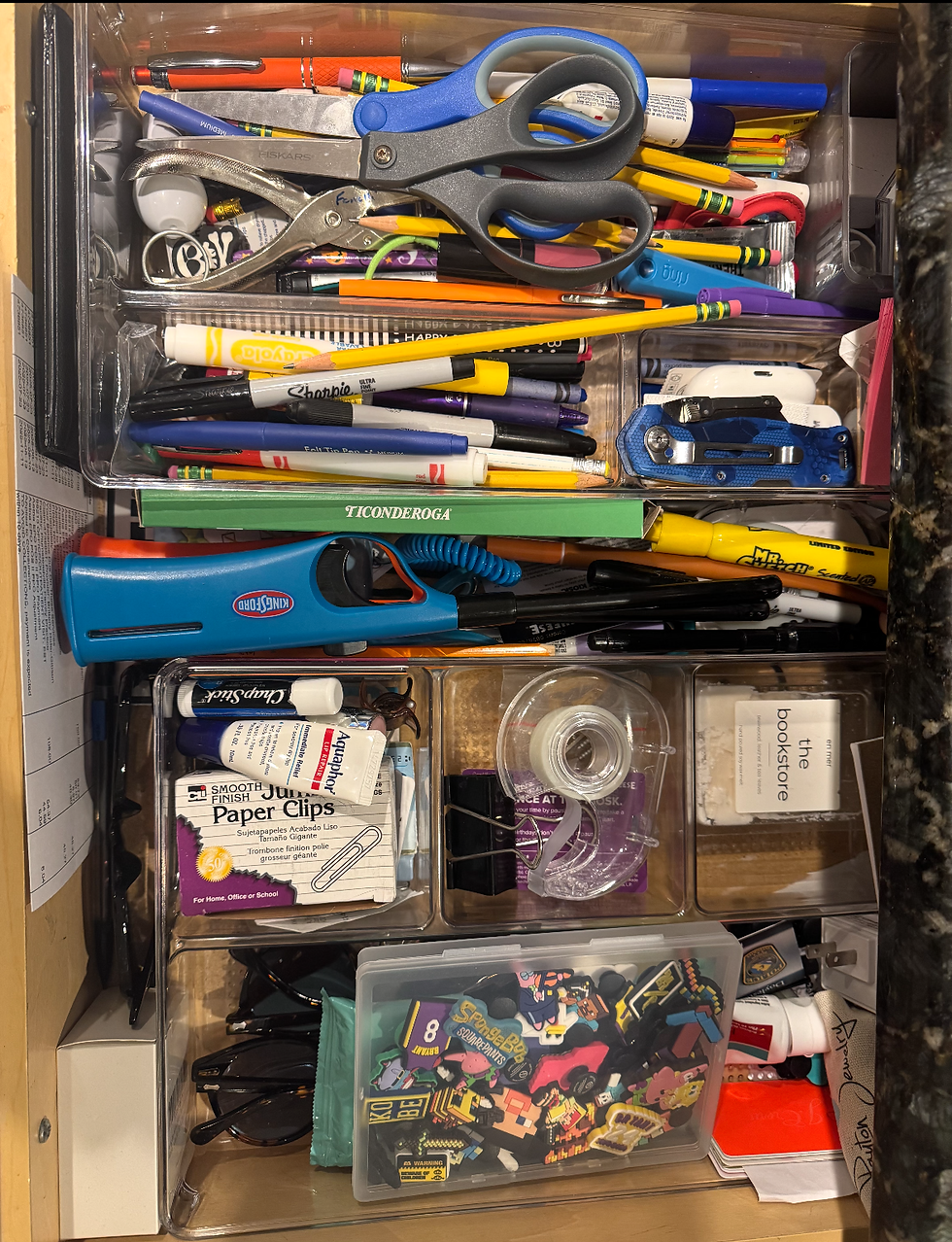 cluttered kitchen junk drawer in a busy home representing motherhood, mental load, and postpartum mental health