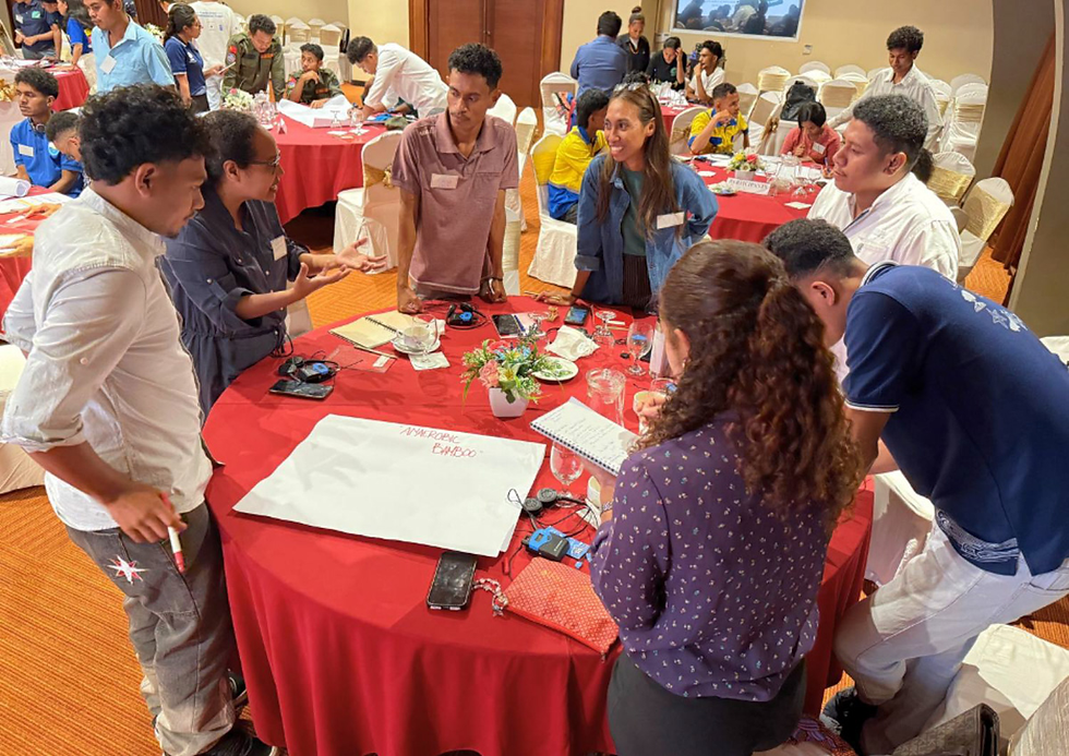 Palensia da Costa Silva and her team brainstorm ideas on bamboo-based renewable energy during the YECAP Bootcamp, shaping the concept of eco-bamboo charcoal as a sustainable solution for rural communities.