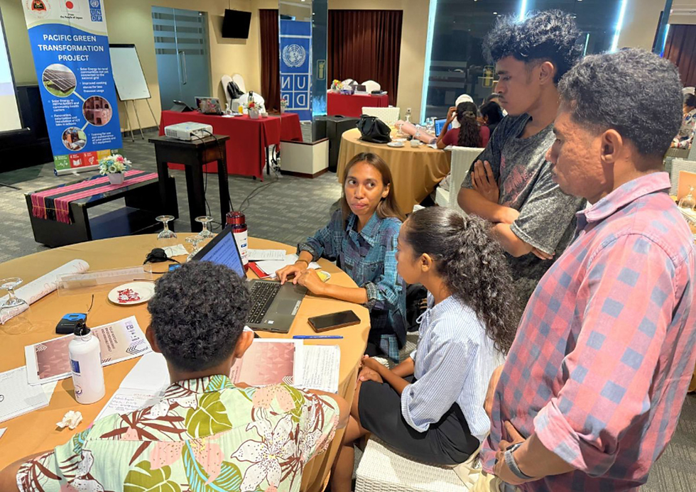 Youth participants engage in an active group discussion during the YECAP Bootcamp, sharing ideas on renewable energy and climate solutions.