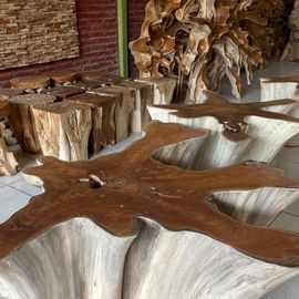 Live-edge solid wood slab table showcasing natural wood contours, organic grain patterns, and hand-finished surface detailing.