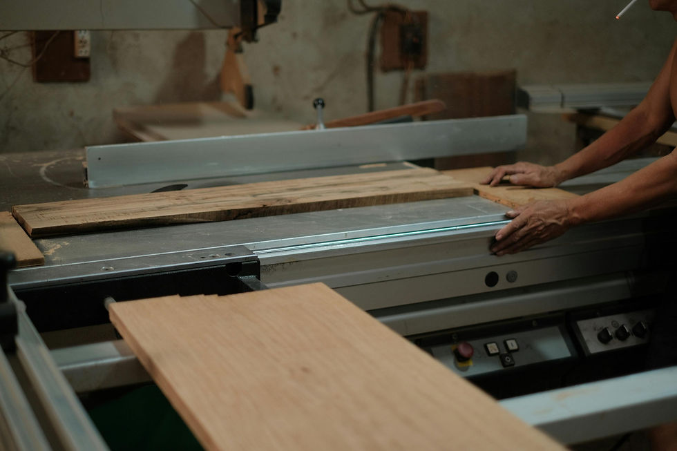 Wood board being cut in an Indonesian furniture manufacturing workshop.