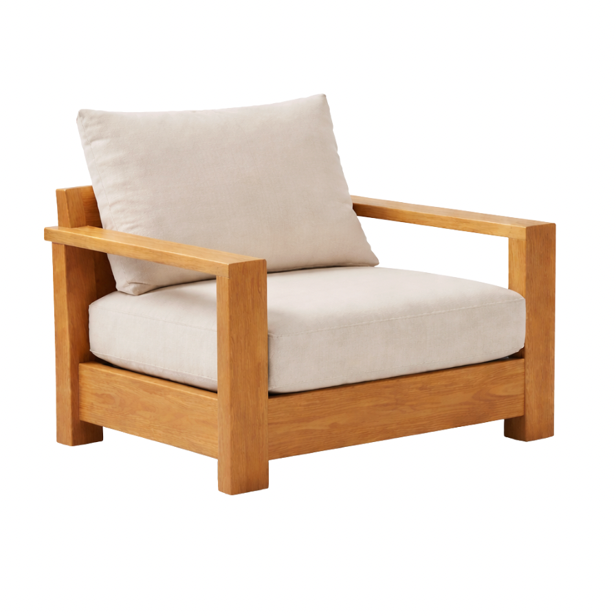 Wide-arm teak armchair with deep outdoor cushions. Modern teak armchair made from Indonesian teak wood