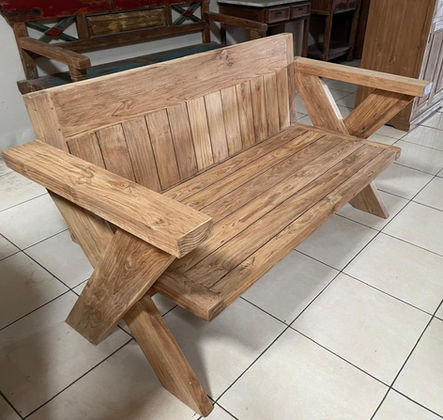 Rustic reclaimed teak bench with a slatted seat, paneled back, and crossed support legs.