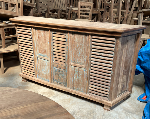 Rustic reclaimed teak sideboard cabinet with louvered doors crafted from recycled teak wood.