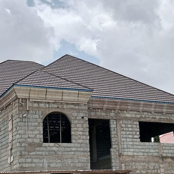 Durable rain-coated roofs offering superior protection against harsh weather. High-quality roofing materials designed for long-lasting performance, ensuring a dry and secure home in all conditions