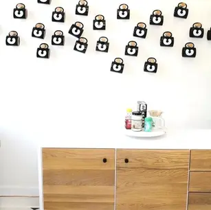 Modern sideboard with decorative wall art above.