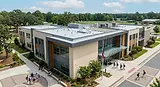 Commercial roofing contractor working on a school building roof in Georgia