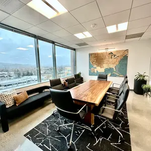 Modern conference room with large window and map.