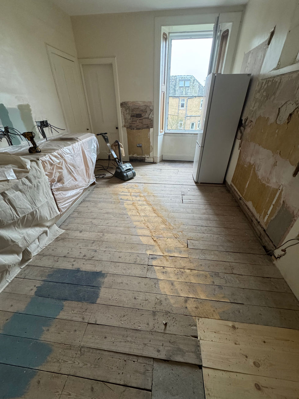 Original tenement solid wood flooring in a kitchen in Edinburgh. Prior to being sanded