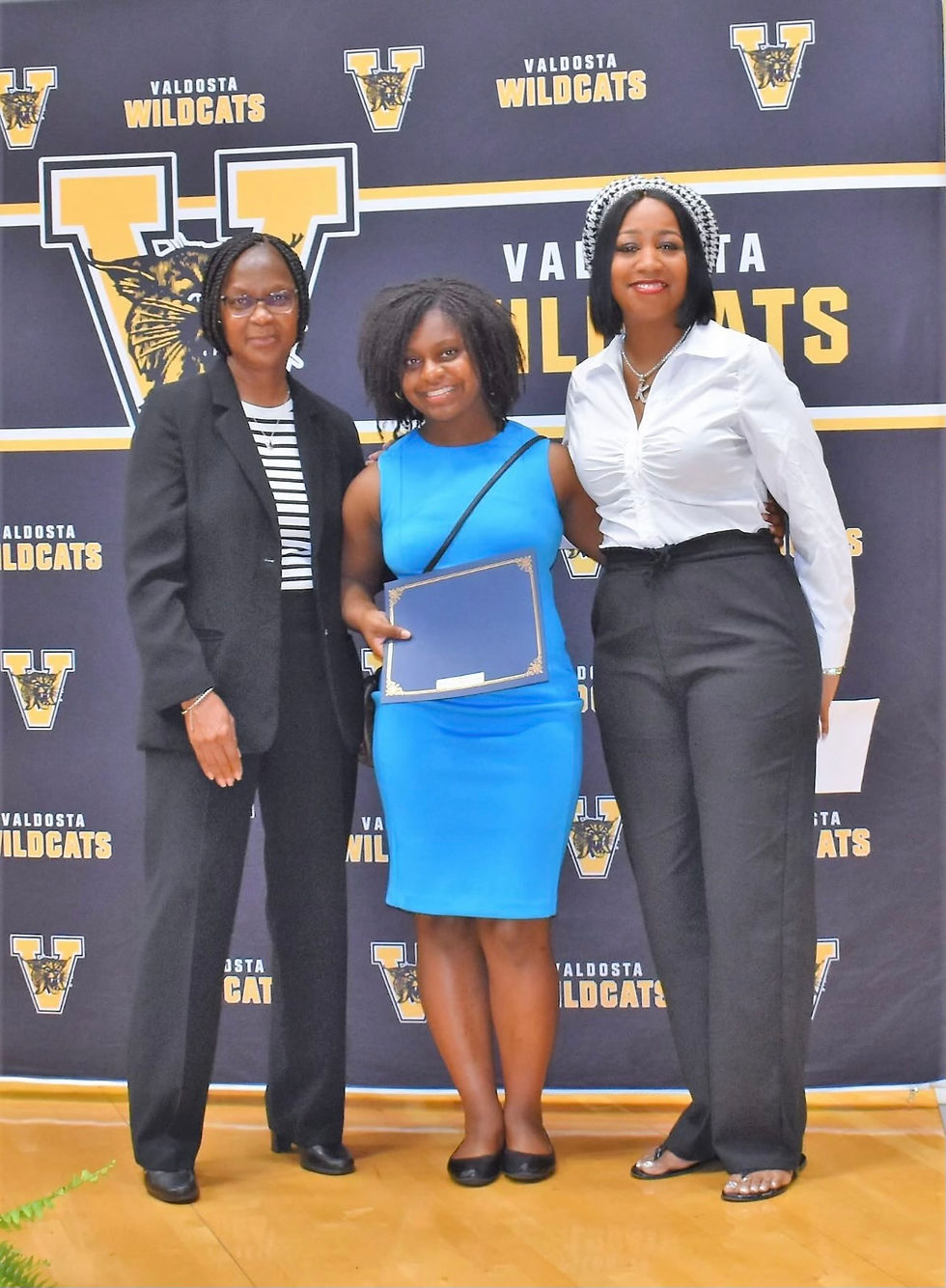 Pictured: Cathy Gordon, Trinity Sherman (recipient), Kesha Moore