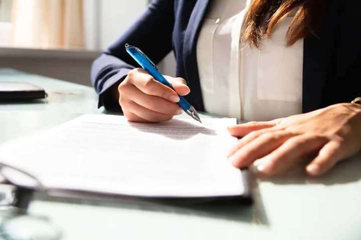 depositphotos_215566538-stock-photo-close-businesswoman-hand-filling-contract.png