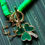 Thumbnail: Narrow Bead Green and Gold Cutout Shamrock+4 leaf clover Necklace