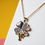 Thumbnail: Golden Rhinestone & Bee Accent 4-Leaf Clover Necklace