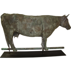 Antique weathered metal cow weather vane