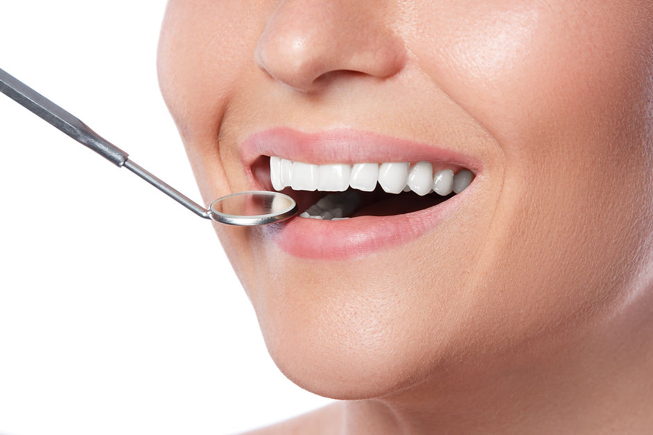 smiling-woman-dental-mirror.jpg