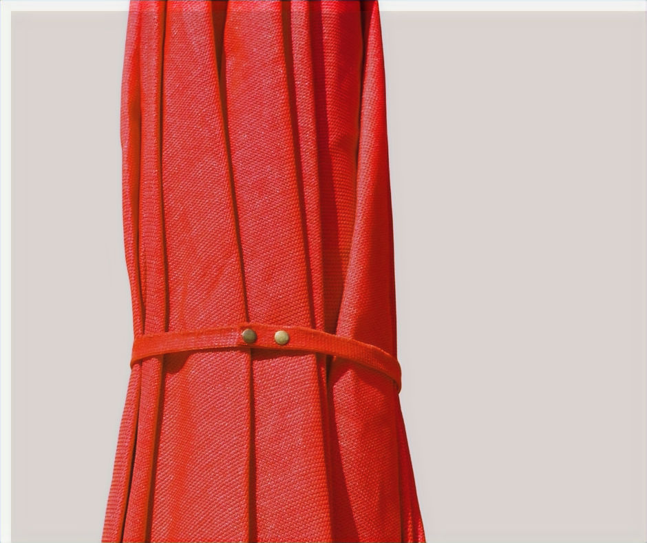 Thumbnail: Folded red umbrella with securing strap - مرسى مطروح