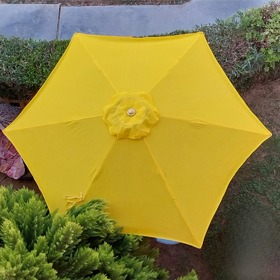Yellow garden umbrella made of high-quality Claro fabric, ideal for outdoor shading in patios, gardens, cafés, and commercial
