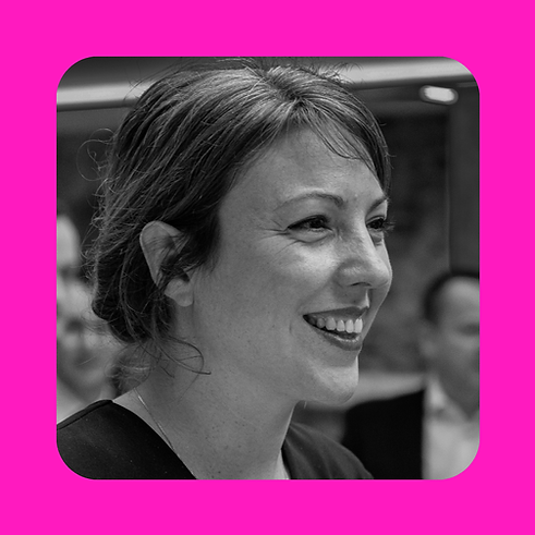 A black and white photo of Clotilde smiling on a bright pink background
