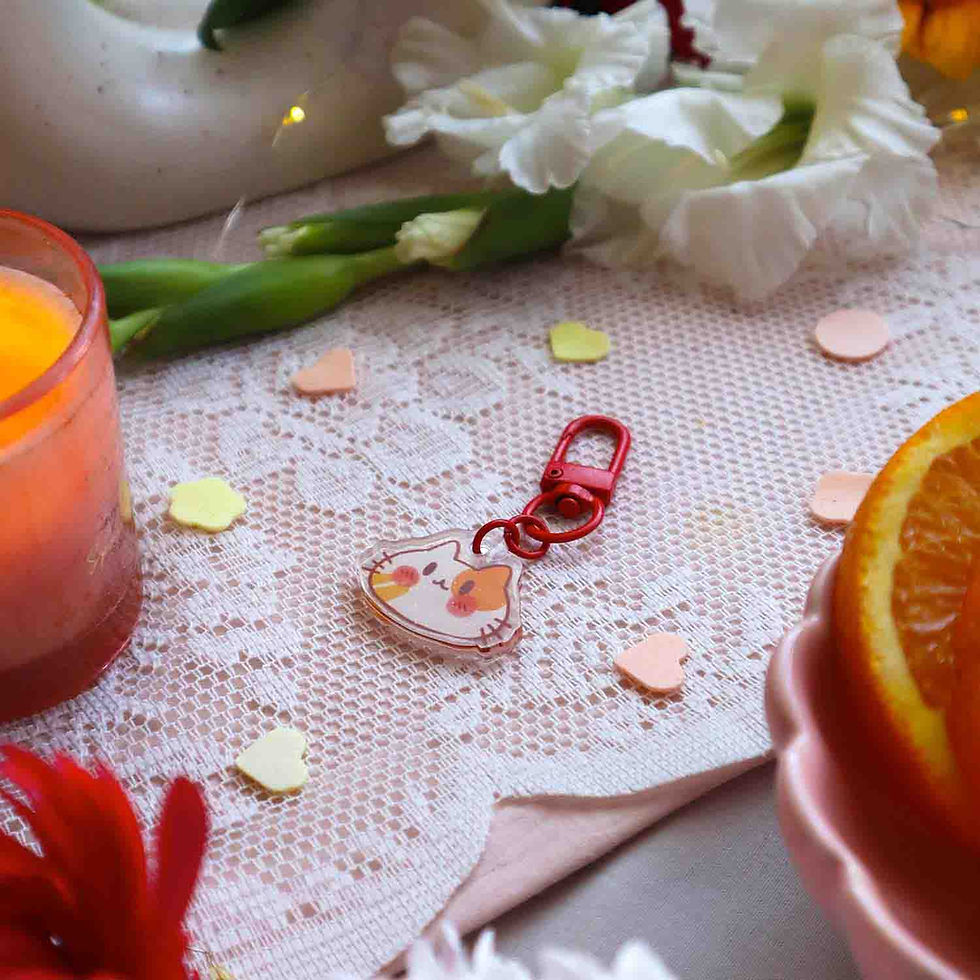 Thumbnail: Kawaii orange cat keychain with a shiny gold heart loop and red loop accessory