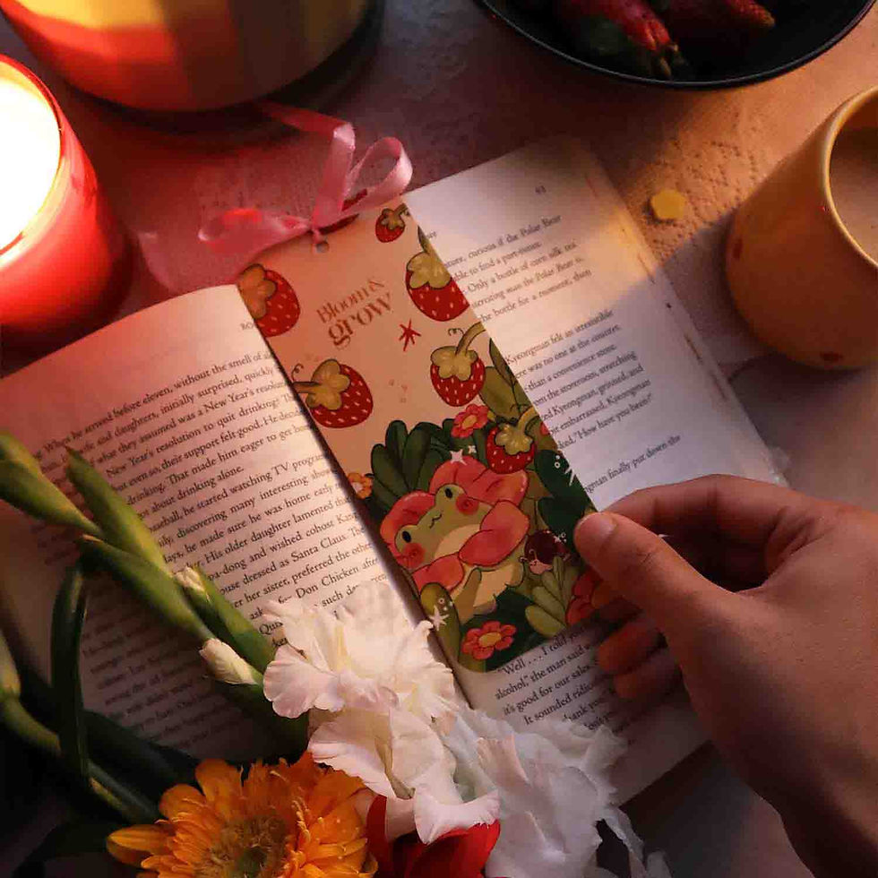 Thumbnail: Cute bookmark with frog, strawberries, and floral artwork and a ribbon bow tied at the top