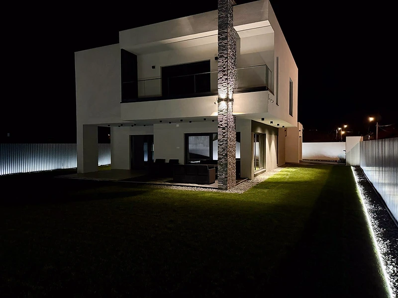 Aspect House villa at night with dramatic lighting