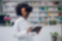 a-young-multiracial-professional-pharmacist looking on tablet_edited.jpg