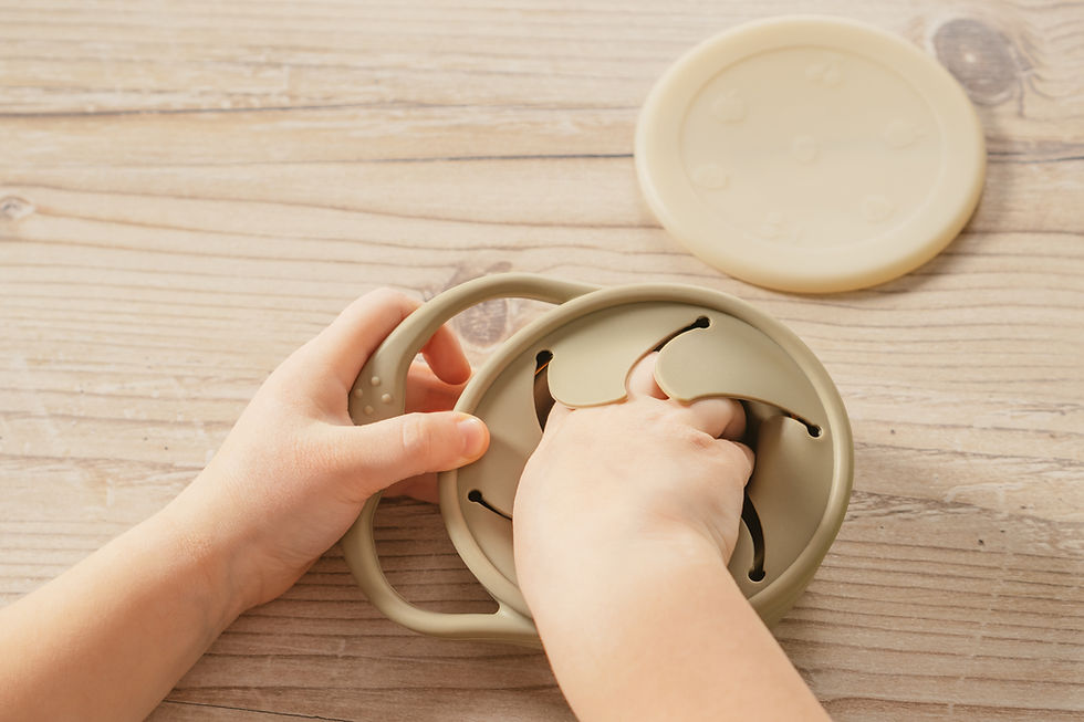 child-reaching-into-snack-container-on-wooden-tabl-2026-03-19-23-55-30-utc.jpg