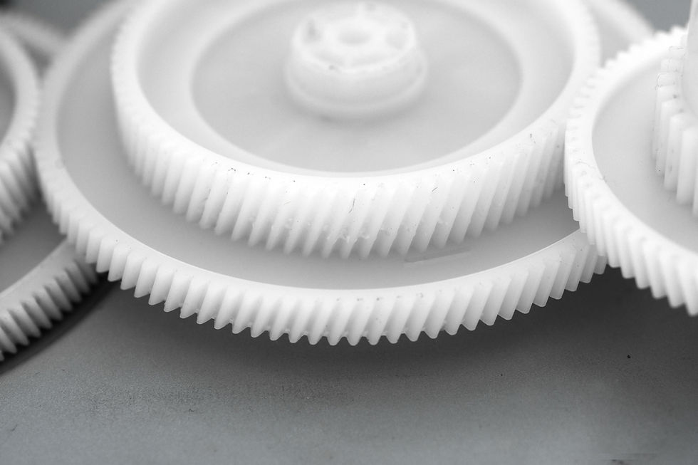 close-up-of-plastic-gears-on-gray-surface-2026-01-11-09-34-37-utc.jpg