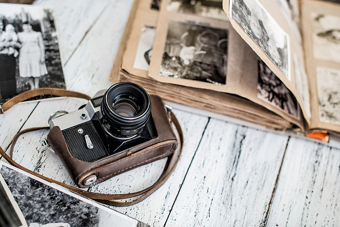 An old film camera and family album on a