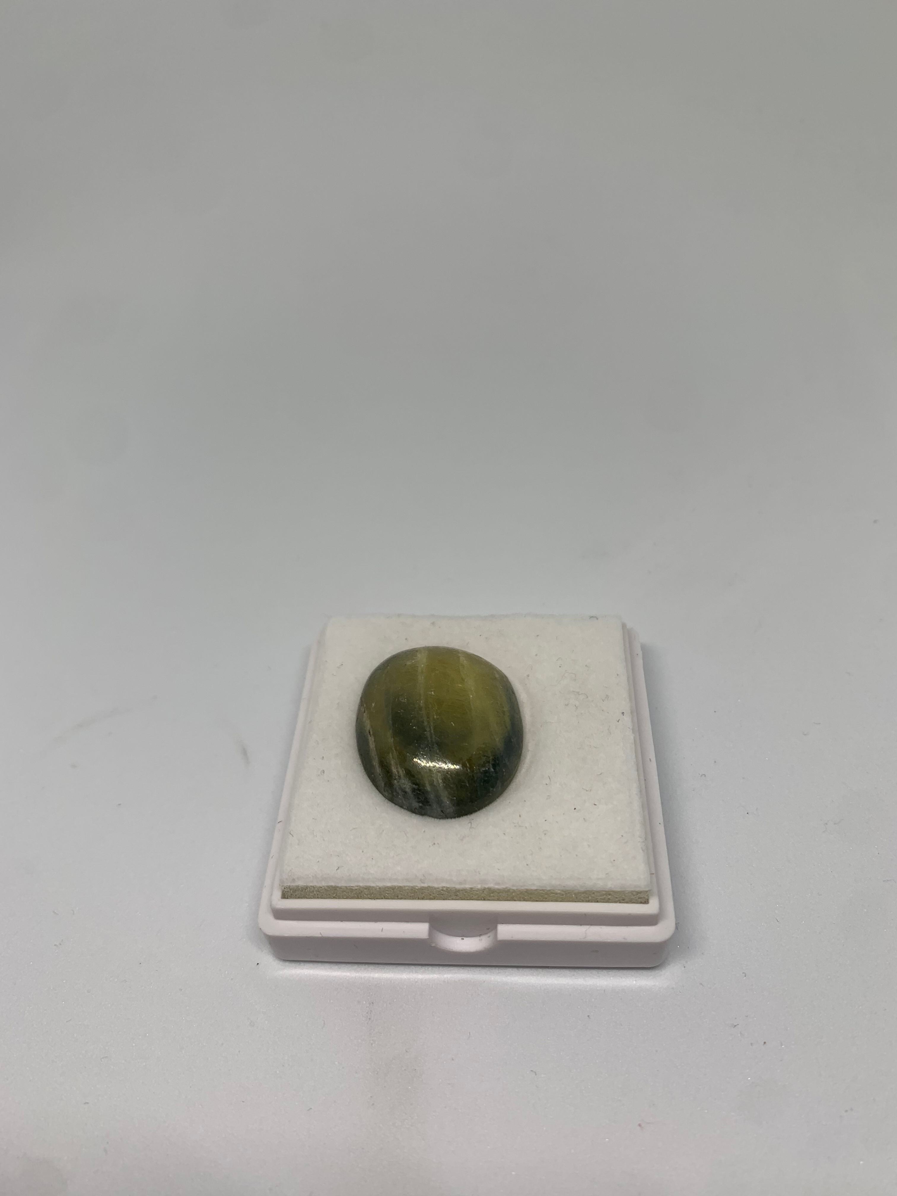 Rare 51ct Oval cabochon green/blue/yellow striated sapphire