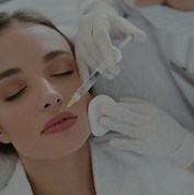 female client getting botox injection on upper lip