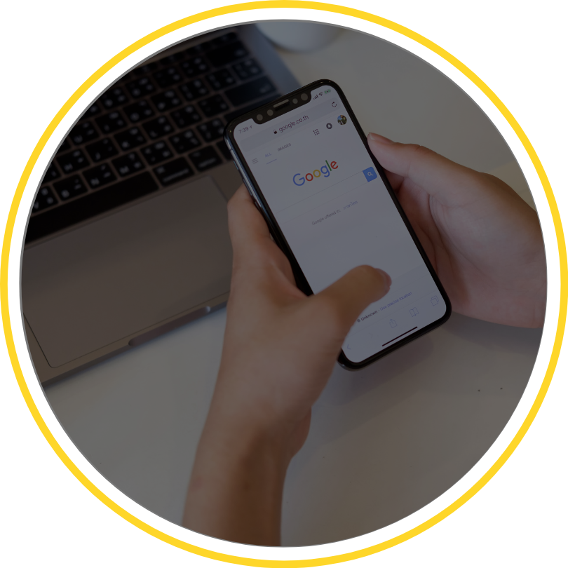 person hands holding a cell phone with google open.