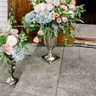 large silver vase with flowers on altar